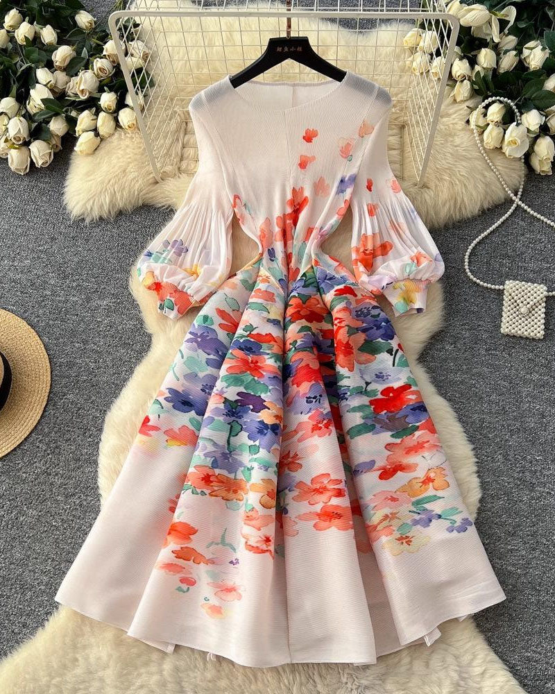 White floral pleated midi dress displayed on hanger