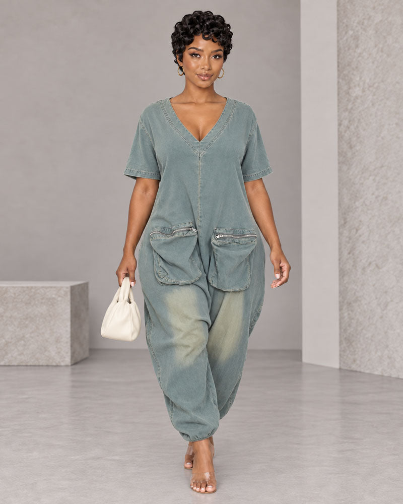 Light-wash oversized V-neck denim jumpsuit, walking front view