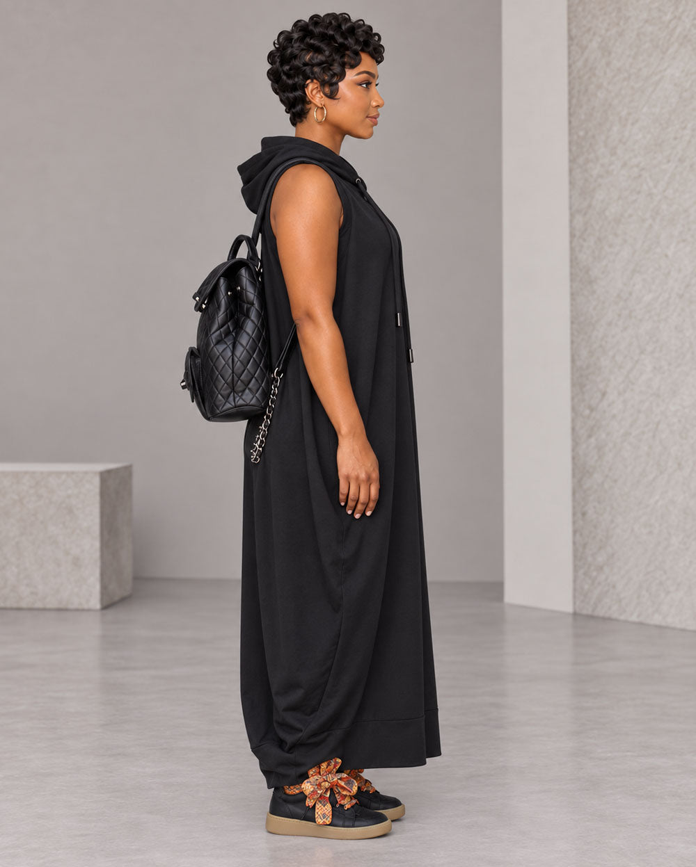 Black oversized sleeveless hoodie maxi dress, side view