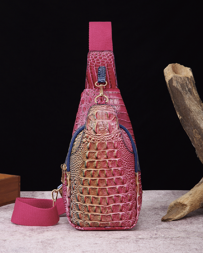 Croc-embossed sling bag with front zip pocket
