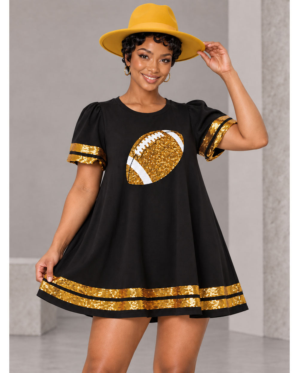 Black sequin football tunic dress, waist-up view
