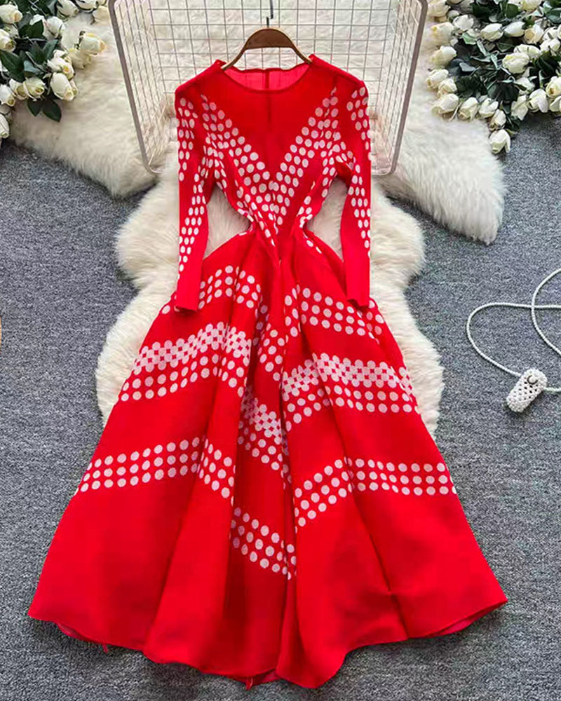 Red zigzag pleated maxi dress displayed on hanger