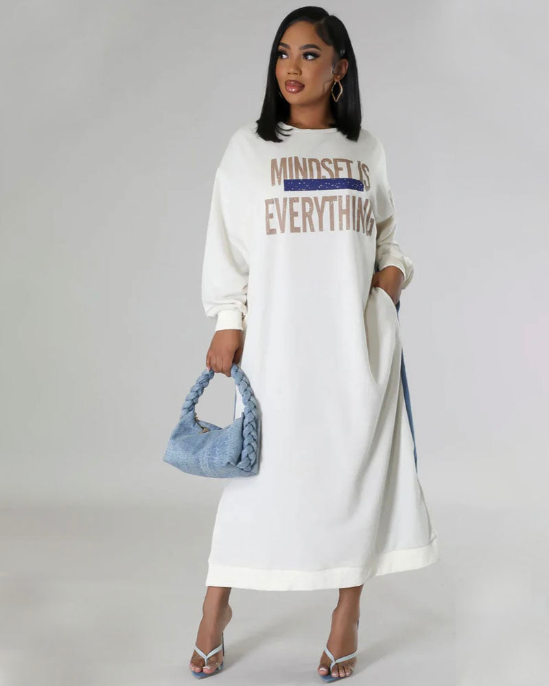 White sweatshirt and denim maxi dress styled with blue handbag