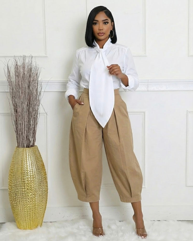 White oversized tie-front shirt styled with khaki pants