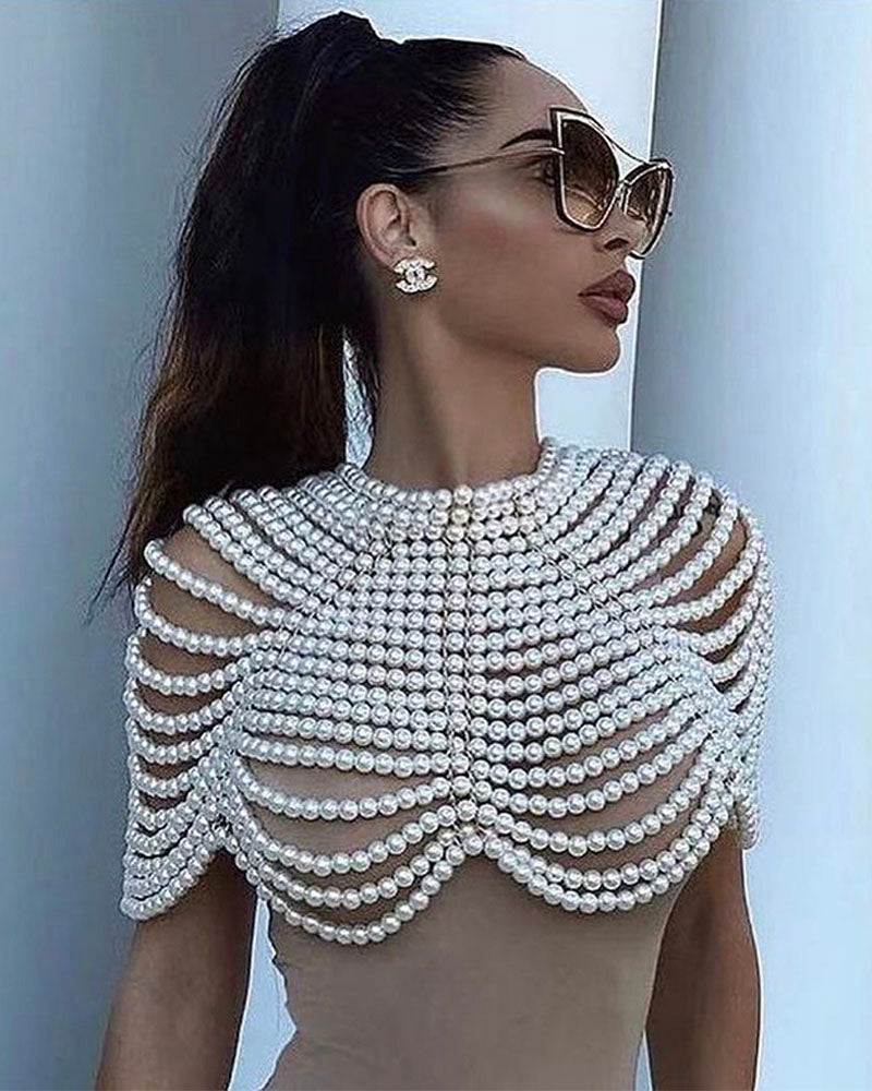 White pearl shoulder shawl styled over white top, side view