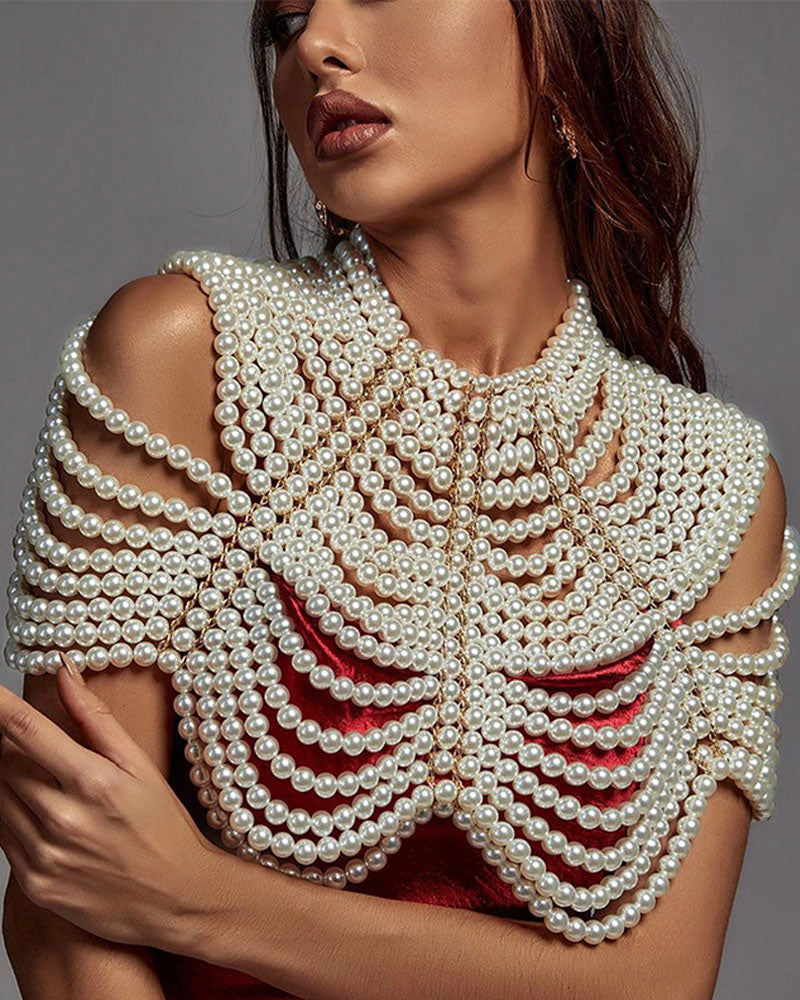 White pearl shoulder shawl styled over red top, front view