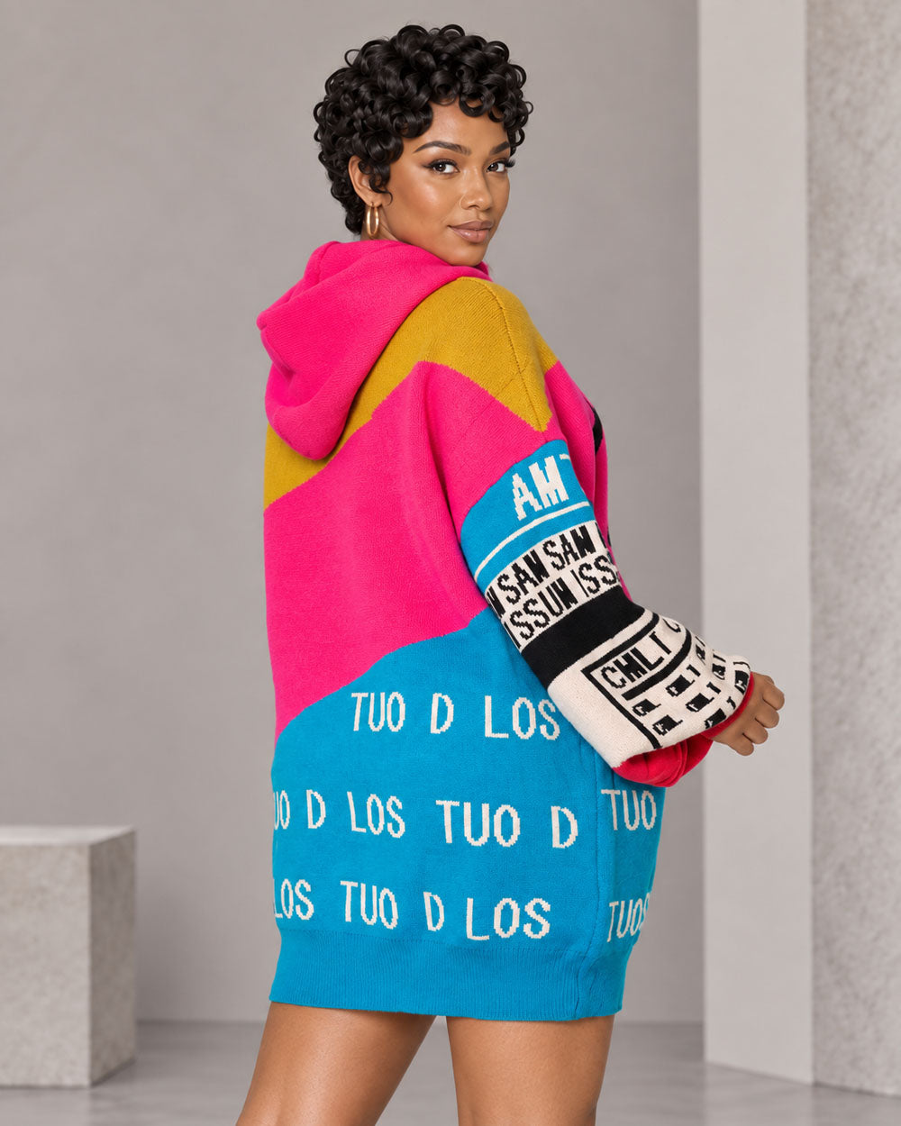 Green graphic hooded sweater mini dress, three-quarter back view