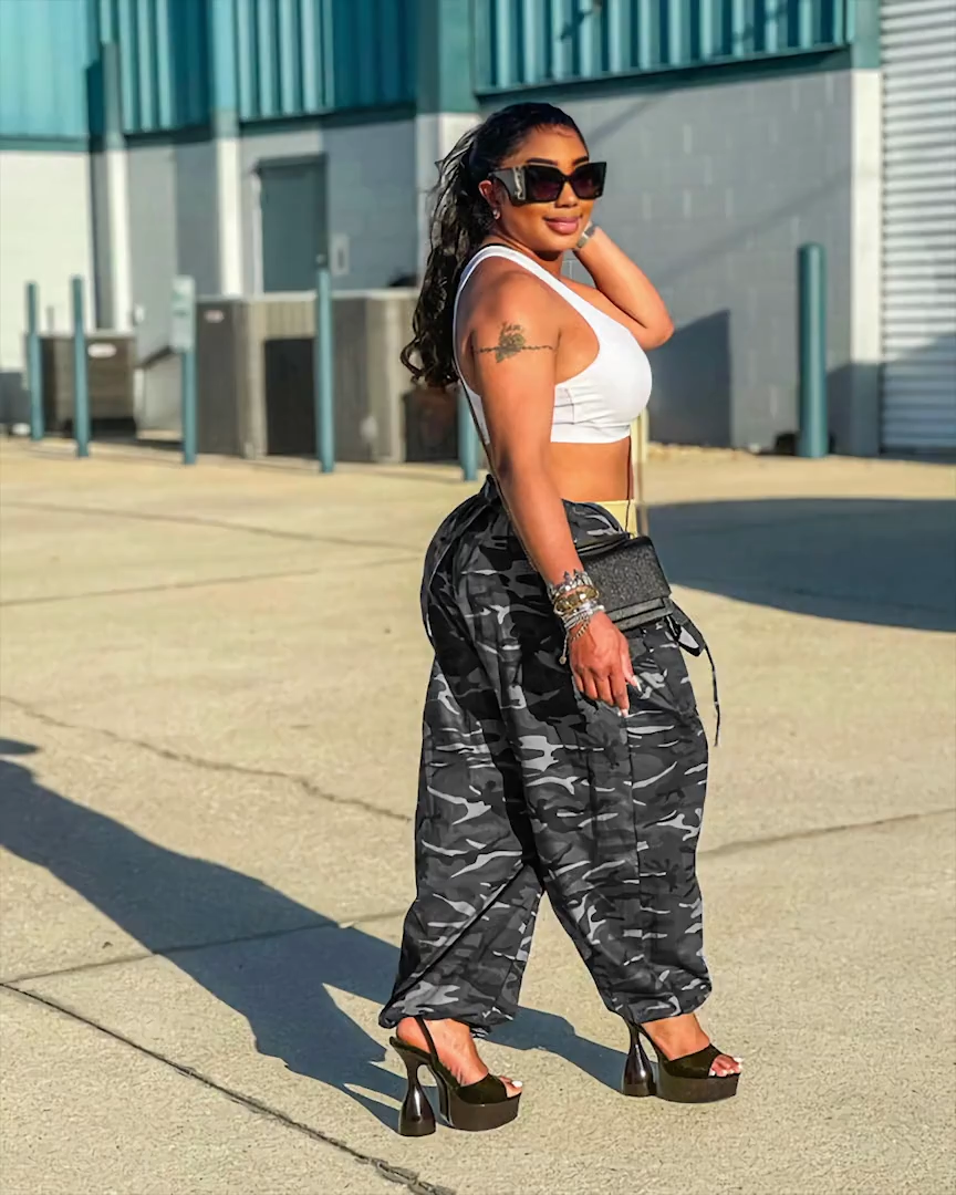 Gray camouflage harem overalls styled outdoors, side view