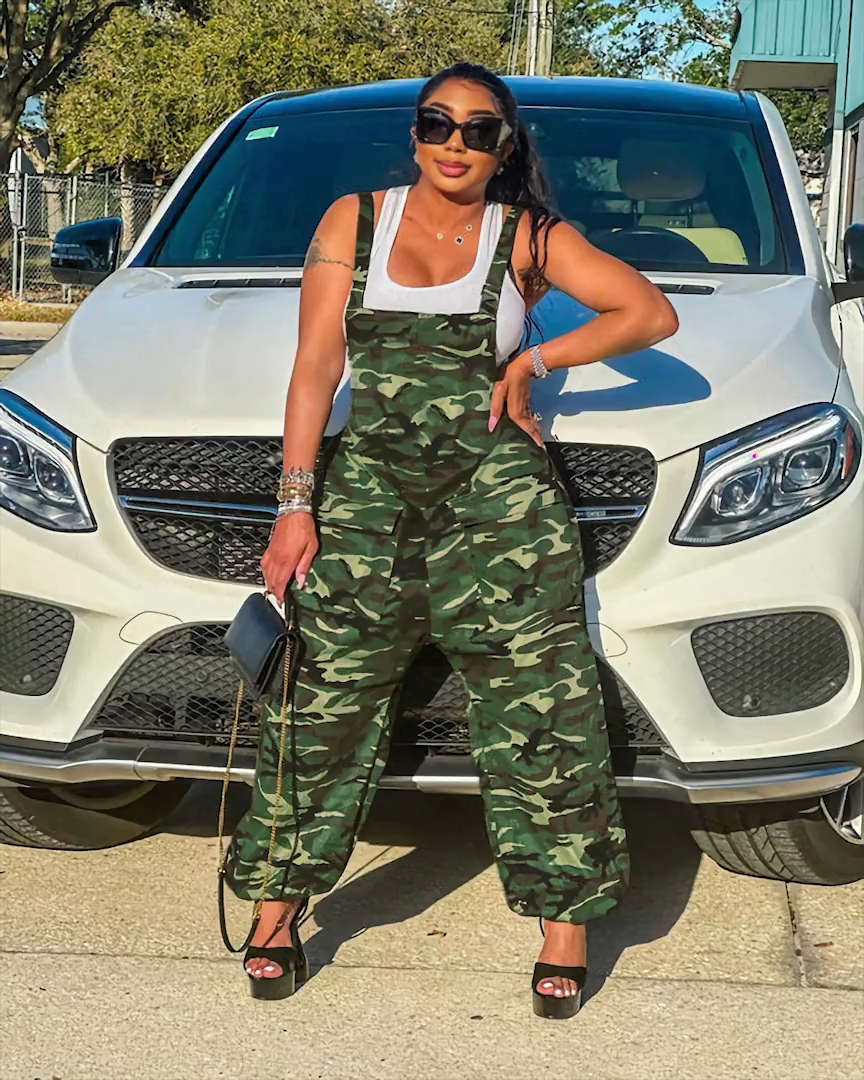 Army green camouflage harem overalls styled by car, angled view