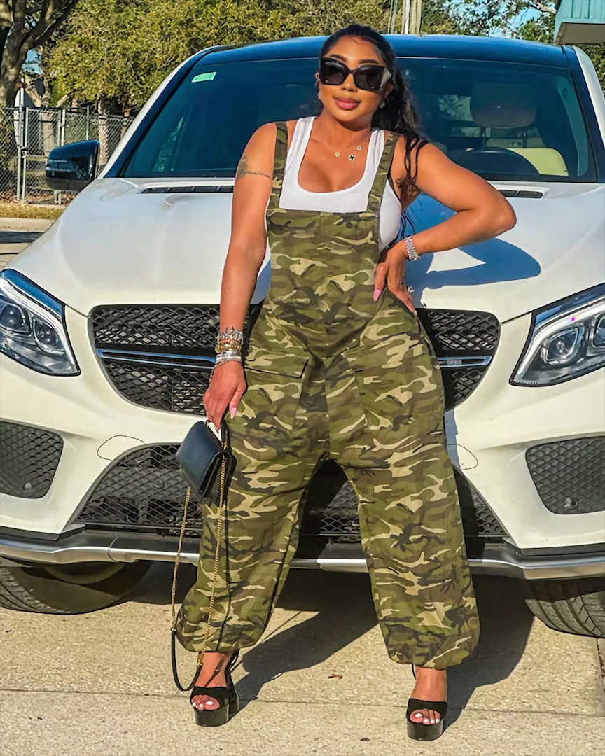 Army green camouflage harem overalls styled by car, front view