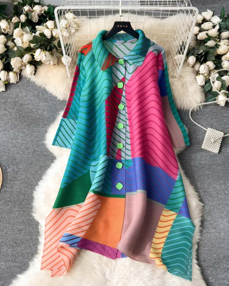 Teal multicolor color-block pleated midi dress displayed on hanger
